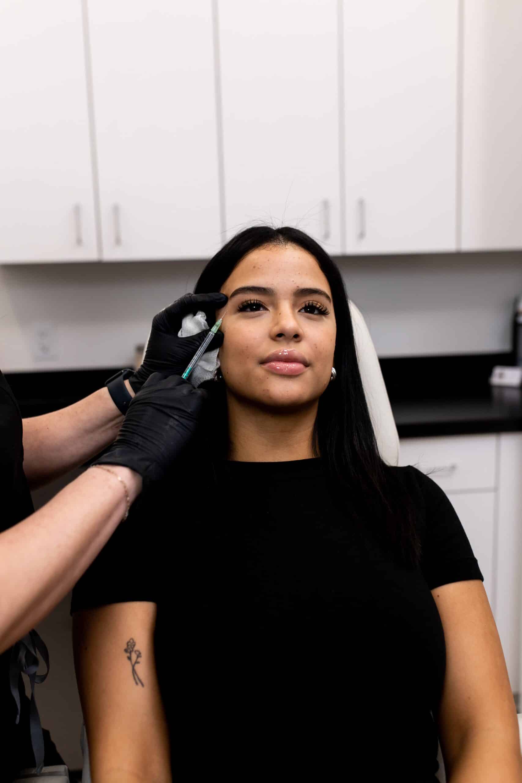 Young woman getting botox